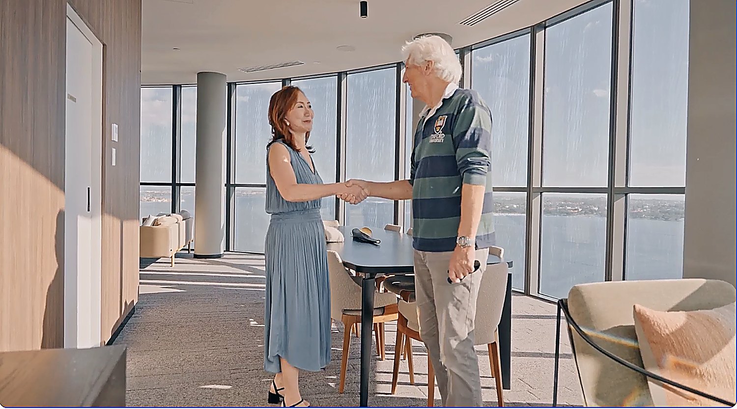 Lisa Loke shaking hands with a client in a Perth apartment